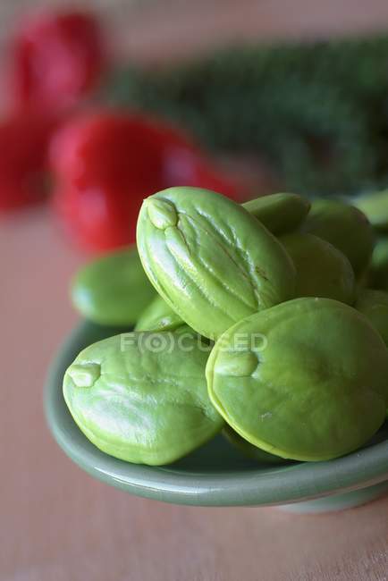 Shelled petai from Indonesia in green bowl — Stock Photo