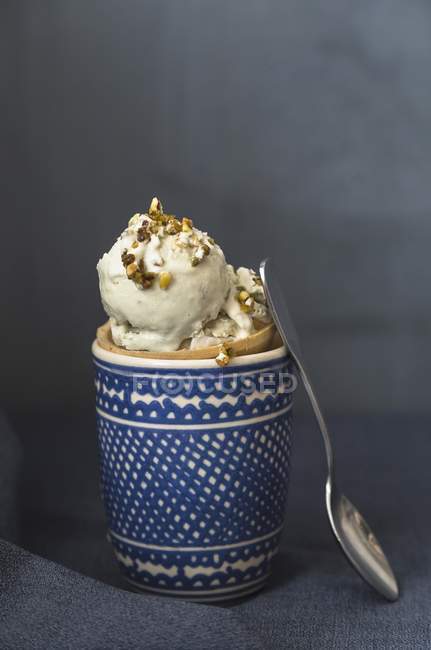 Pistachio ice cream in a cone — Stock Photo