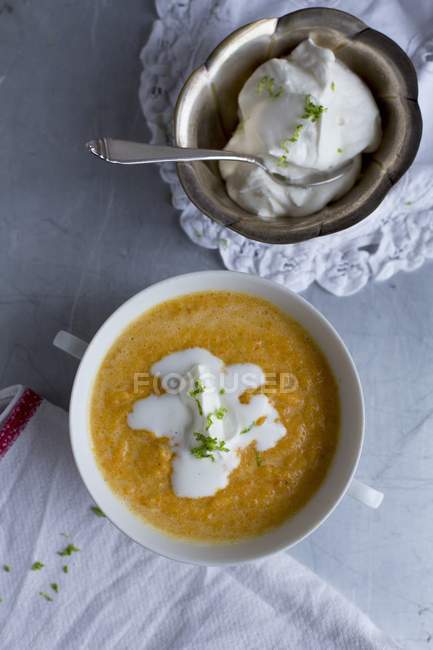 Carrot and ginger soup with cream — Stock Photo