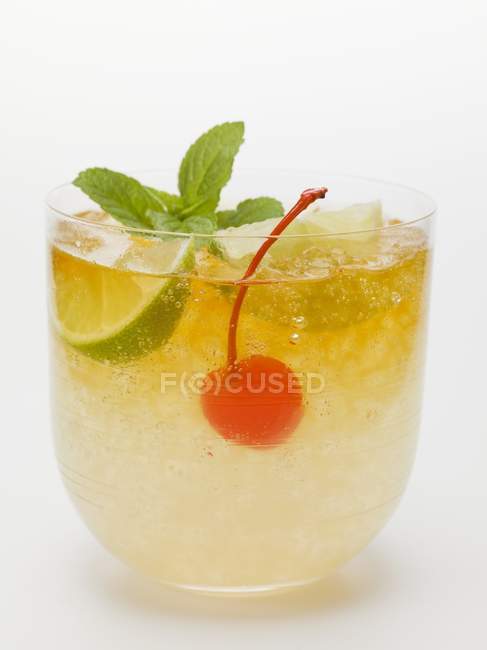 Manhattan with lime and cocktail cherry — Stock Photo