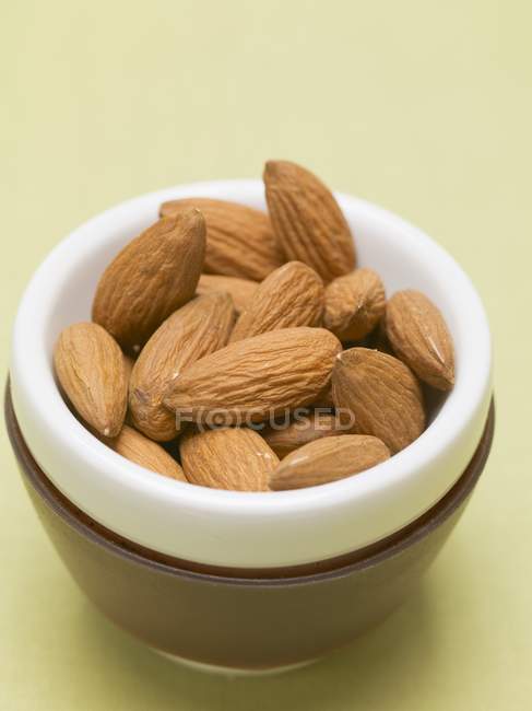 Almonds in small dish — Stock Photo