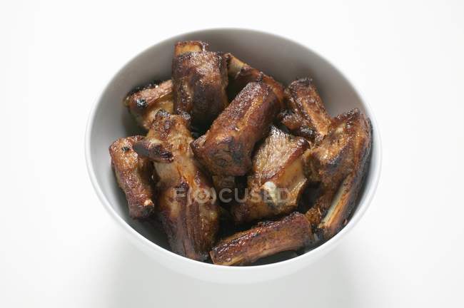 Roasted pork ribs in bowl — Stock Photo