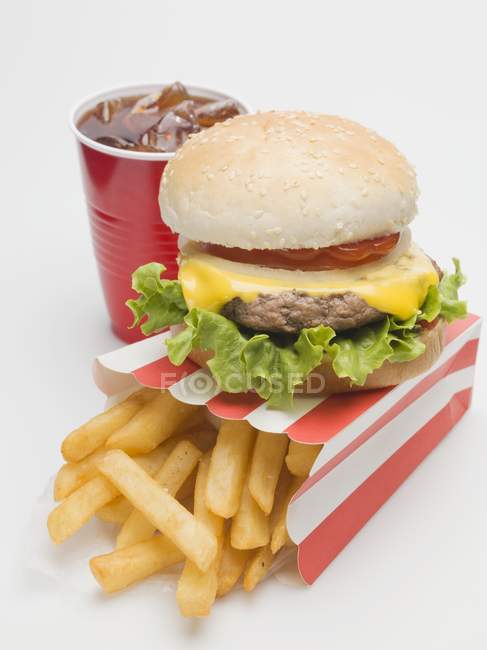 Cheeseburger with potato fries and cola — Stock Photo