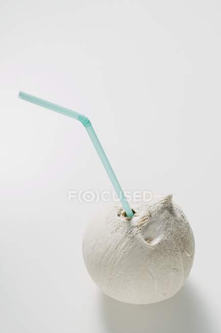 Shelled coconut with straw — Stock Photo