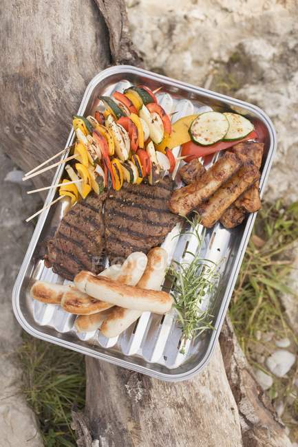 Grilled food in dish — Stock Photo