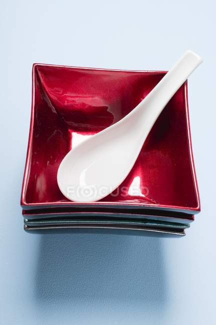 Closeup view of lacquer bowls with spoon — Stock Photo