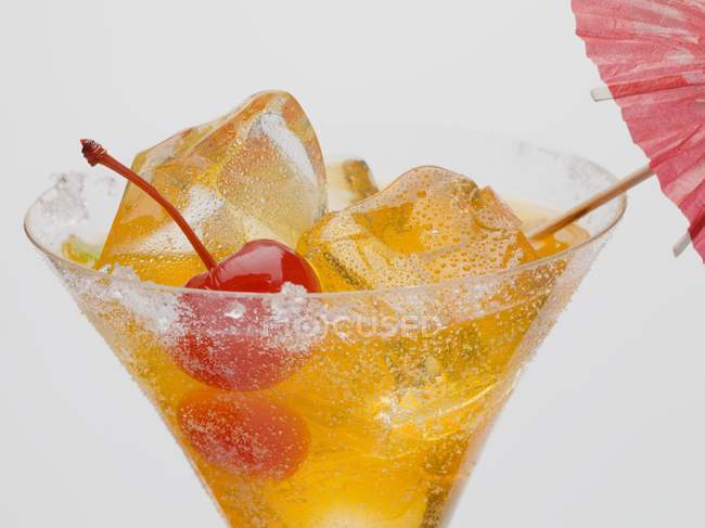 Tequila Sunrise with cocktail cherry — Stock Photo