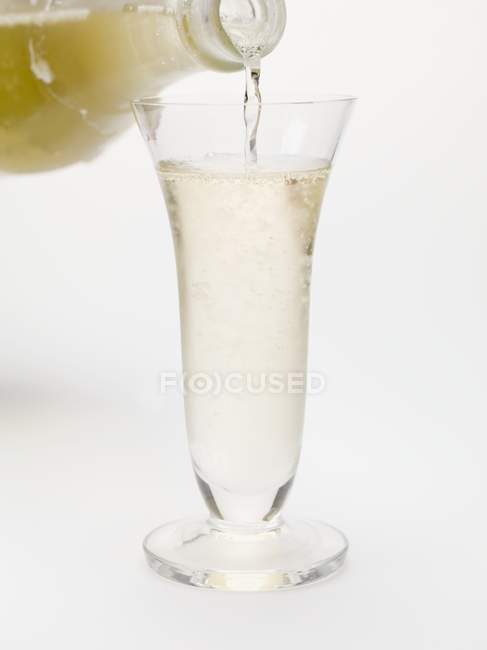 Pouring sparkling wine — Stock Photo