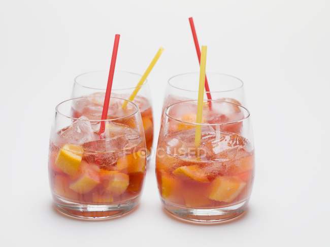 Fruity red wine punch in four glasses — Stock Photo
