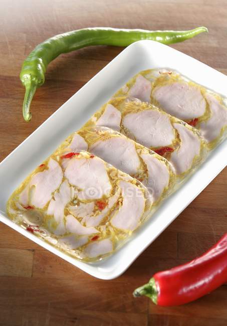 Several slices of turkey breast in jelly — Stock Photo