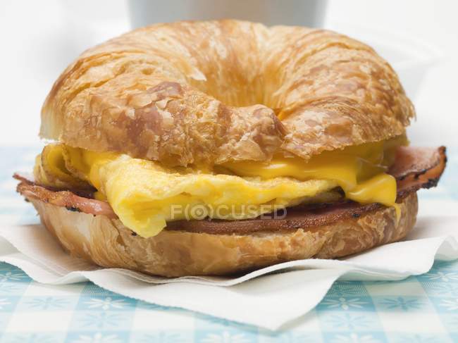 Croissant with scrambled egg — Stock Photo
