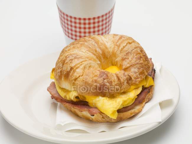 Croissant filled with egg — Stock Photo
