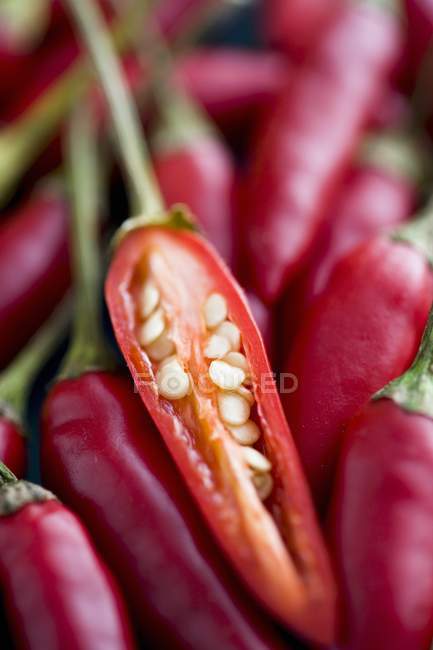 Red Thai chillies with half — Stock Photo