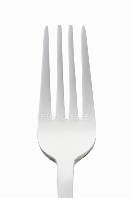Primo piano vista di una forchetta su sfondo bianco — Foto stock