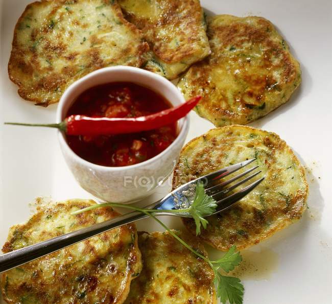 Courgette pancakes with salsa — Stock Photo