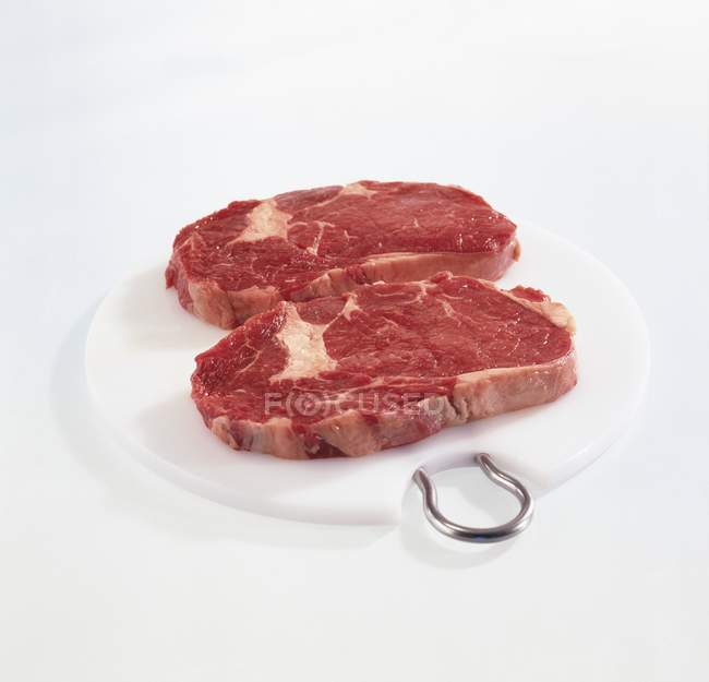 Two steaks on board — Stock Photo