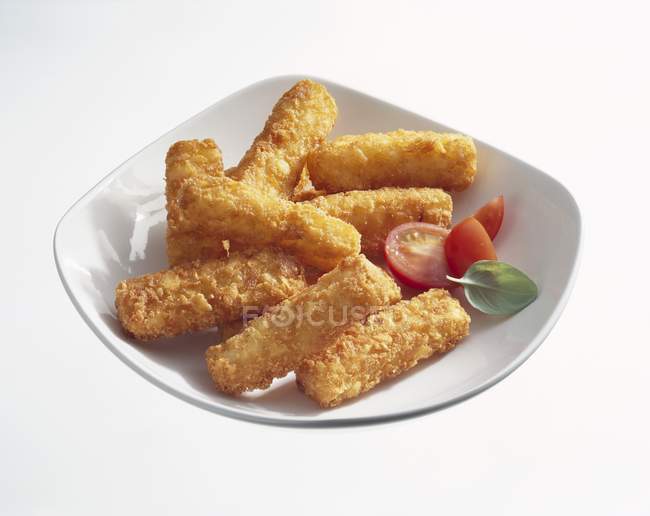 Potato rsti sticks  on white plate — Stock Photo