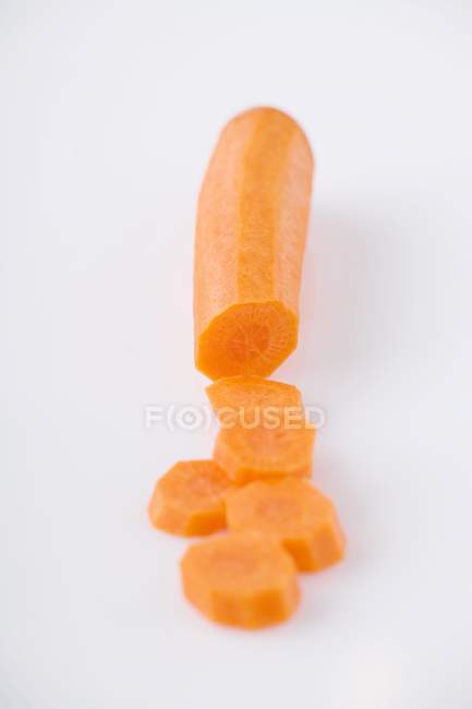Partly sliced fresh carrot — Stock Photo