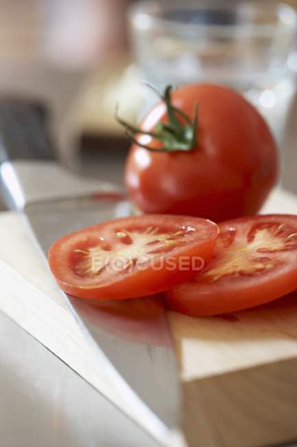 Fresh tomato with slices — Stock Photo
