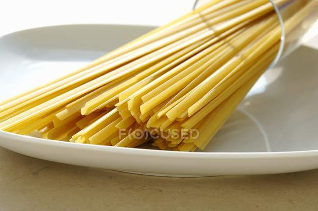 Raw fettuccine pasta — Stock Photo
