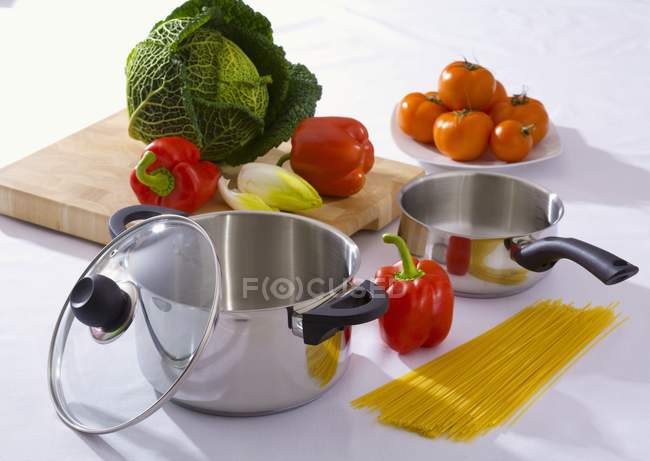 Still life with pans and spaghetti — Stock Photo
