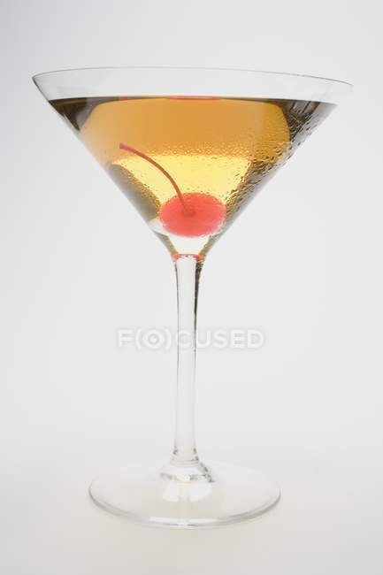 Manhattan with cocktail cherry — Stock Photo