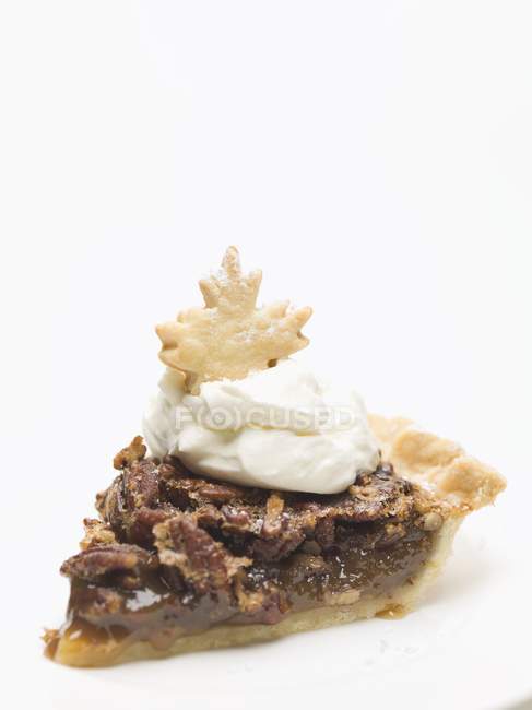 Piece of pecan pie with cream — Stock Photo