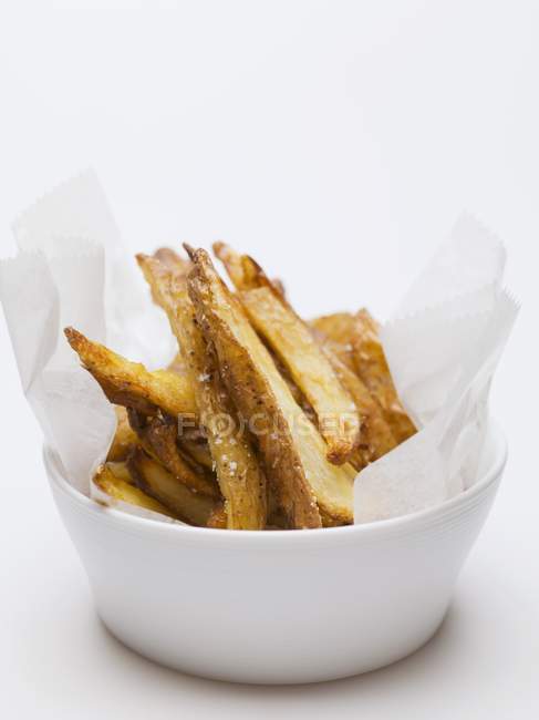 Salted potato chips in bowl — Stock Photo