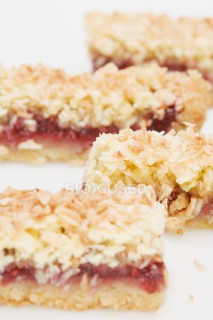 Closeup view of coconut slices with raspberry jam filling — Stock Photo