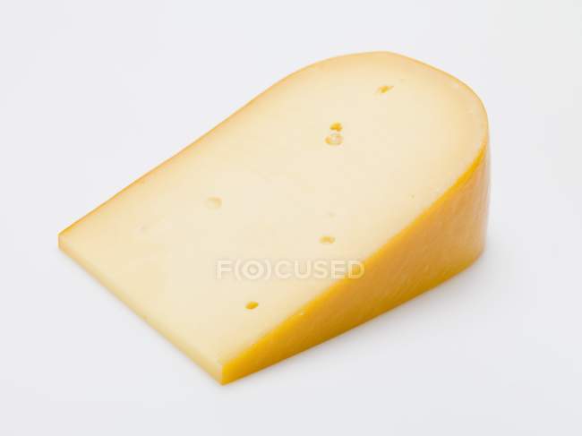 Piece of Gouda cheese — Stock Photo