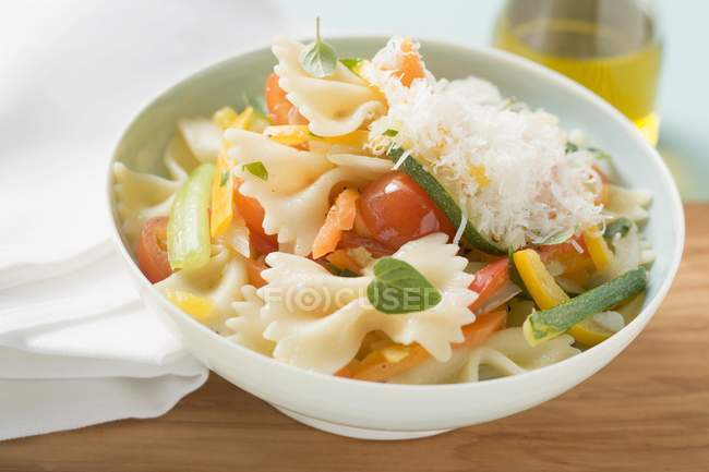 Farfalle primavera with vegetables and cheese — Stock Photo