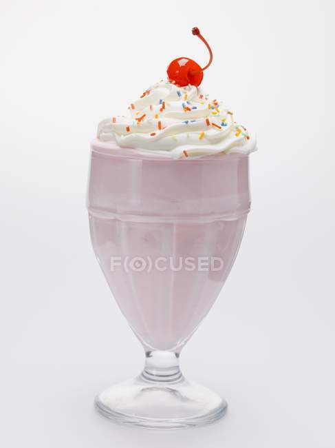 Milkshake with cream and cocktail cherry — Stock Photo