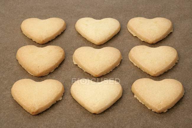 Rows of Heart-shaped biscuits — Stock Photo