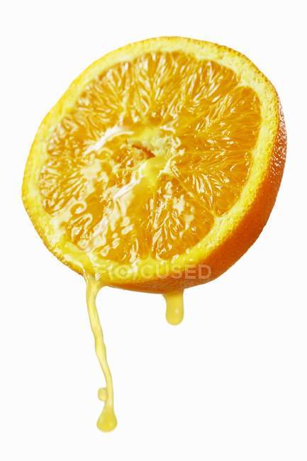 Succo gocciolante arancione — Foto stock