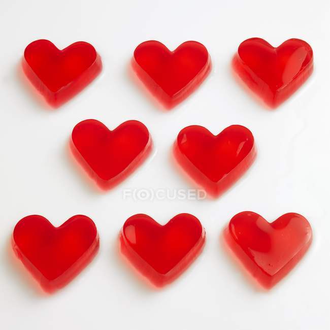 Red raspberry jelly hearts — Stock Photo