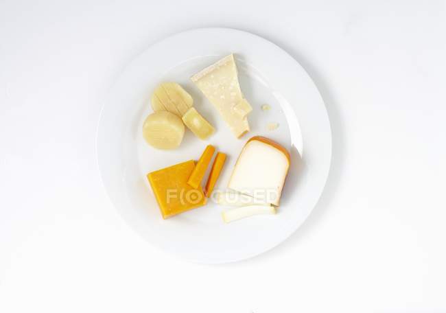 Various cheeses on plate — Stock Photo