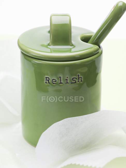 Closeup view of green ceramic pot with lid and word Relish — Stock Photo