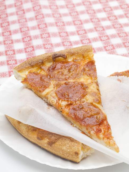Slices of salami pizza — Stock Photo