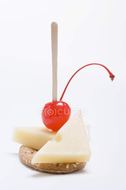 Emmental cheese and cherry — Stock Photo