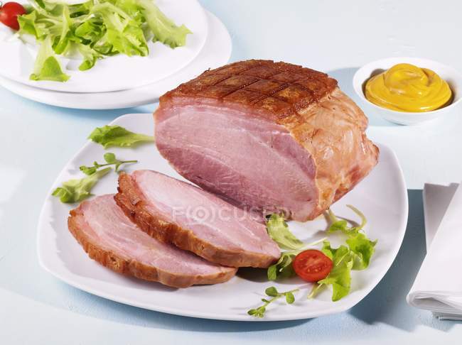 Partly sliced Cooked ham — Stock Photo