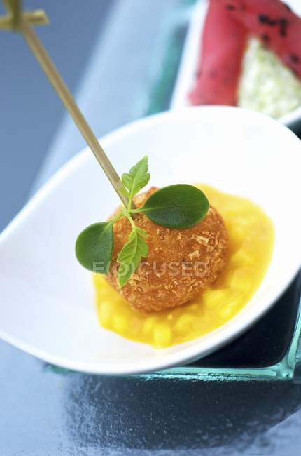 Fishcake with pineapple sauce — Stock Photo