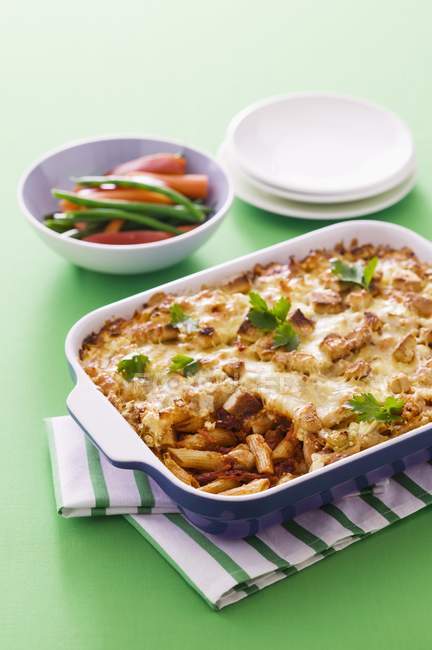 Penne pasta bake with dried tomatoes — Stock Photo