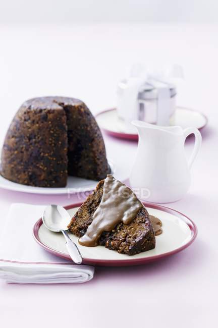 Figgy pudding with butterscotch sauce — Stock Photo