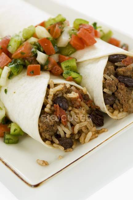 Beef and raisin burritos with rice — Stock Photo