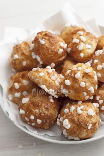 French profiteroles with sugar crystals — Stock Photo