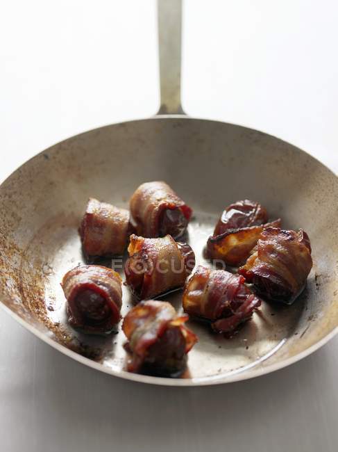 Dates Wrapped in Bacon — Stock Photo