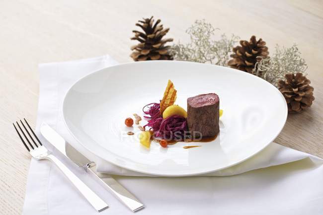 Saddle of venison with cabbage — Stock Photo