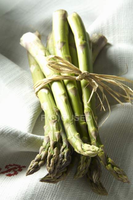 Green asparagus tied with rope — Stock Photo