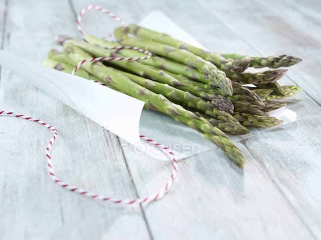 Asparagus on piece of paper — Stock Photo