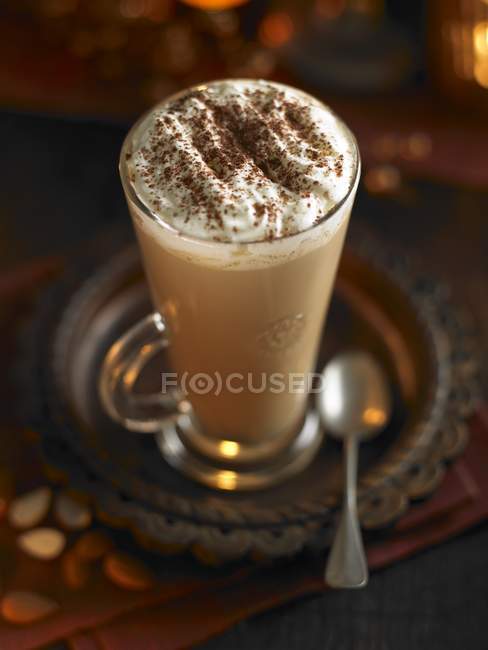 Caffe latte topped with cream — Stock Photo